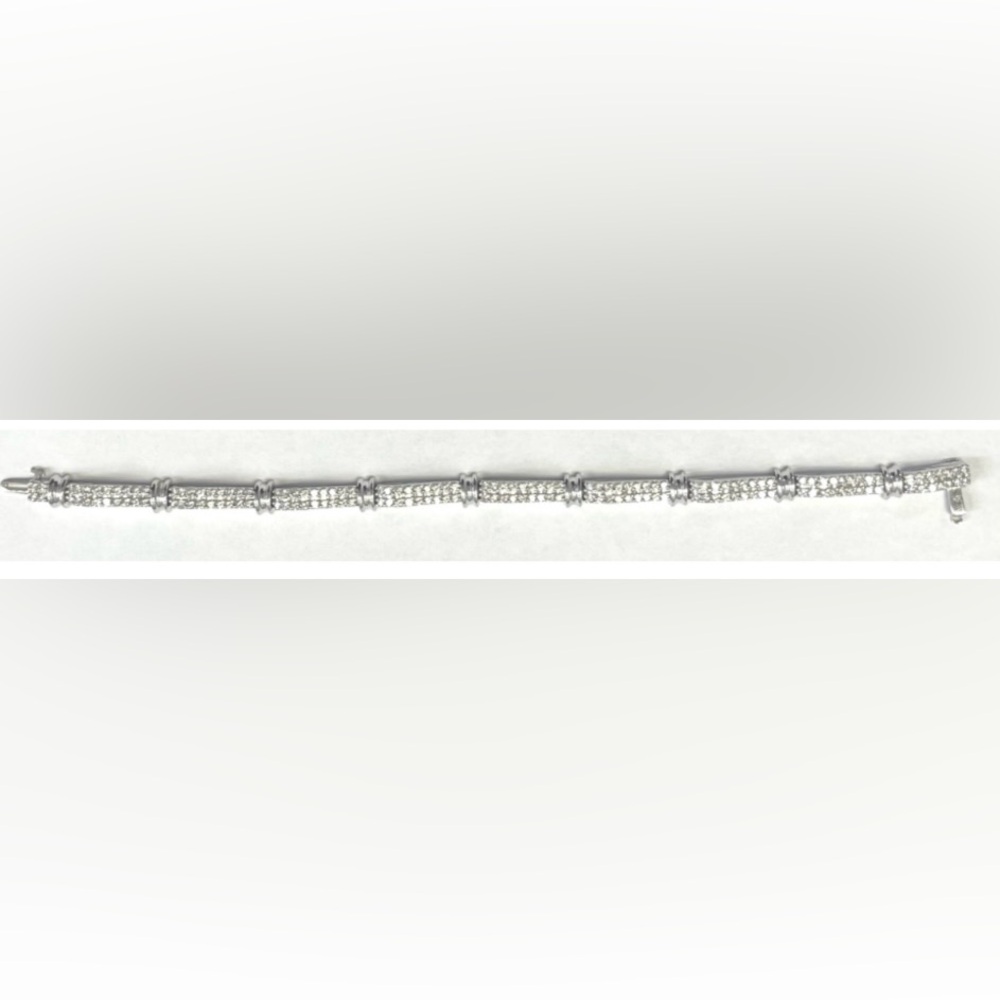 Ladies 14K white gold and diamond tennis bracelet.